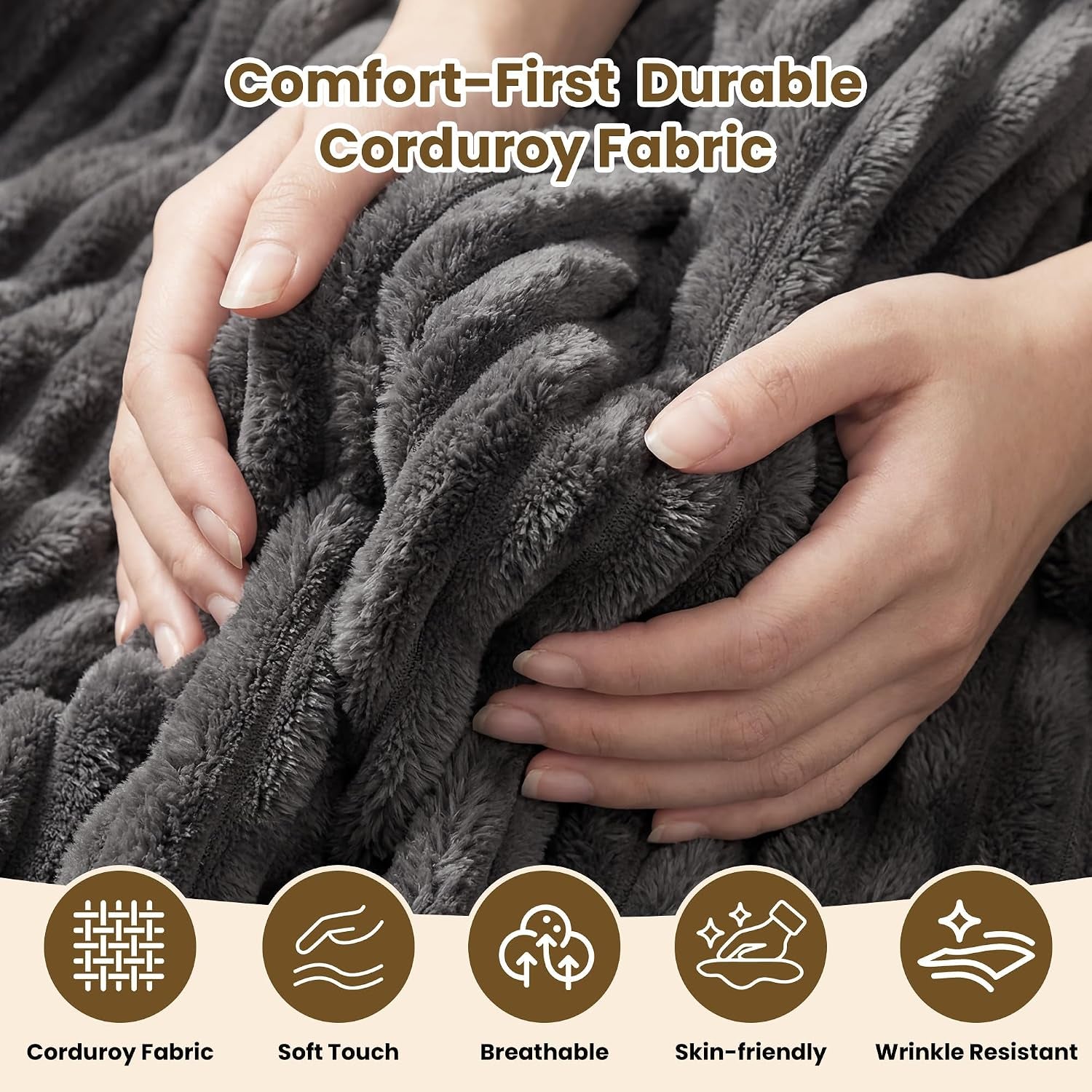 Close-up of hands squeezing plush gray corduroy fabric to show the soft, ribbed texture