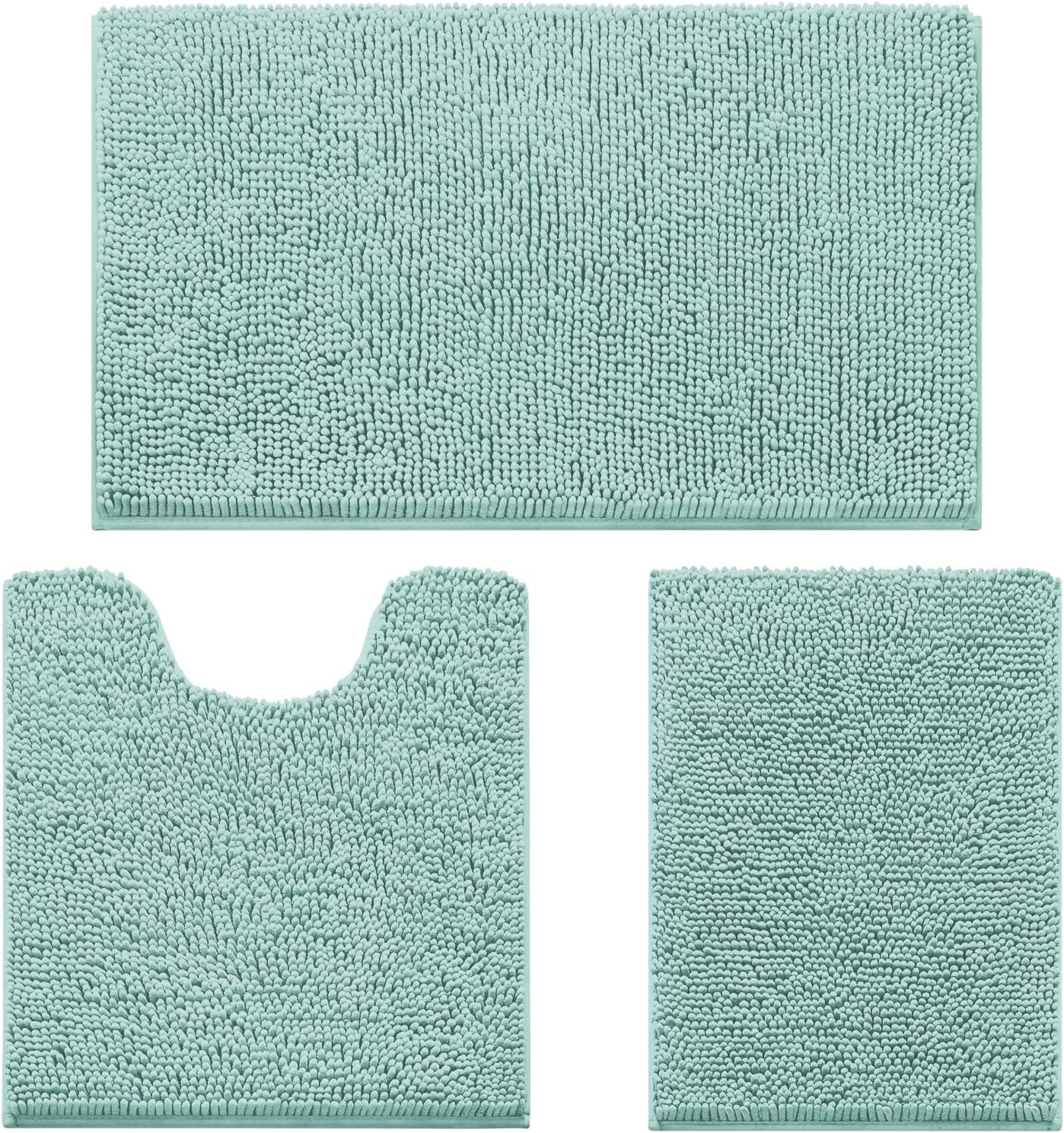 Flat lay of a three-piece chenille bathroom rug set in pale aqua: rectangular mat, U-shaped toilet rug, and small