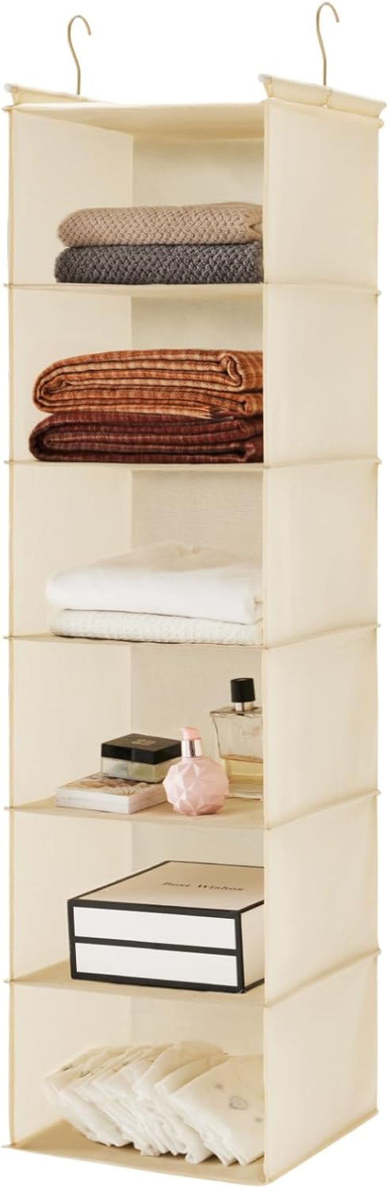 Beige/cream 6-tier hanging closet organizer with folded linens, small boxes and toiletries on the shelves