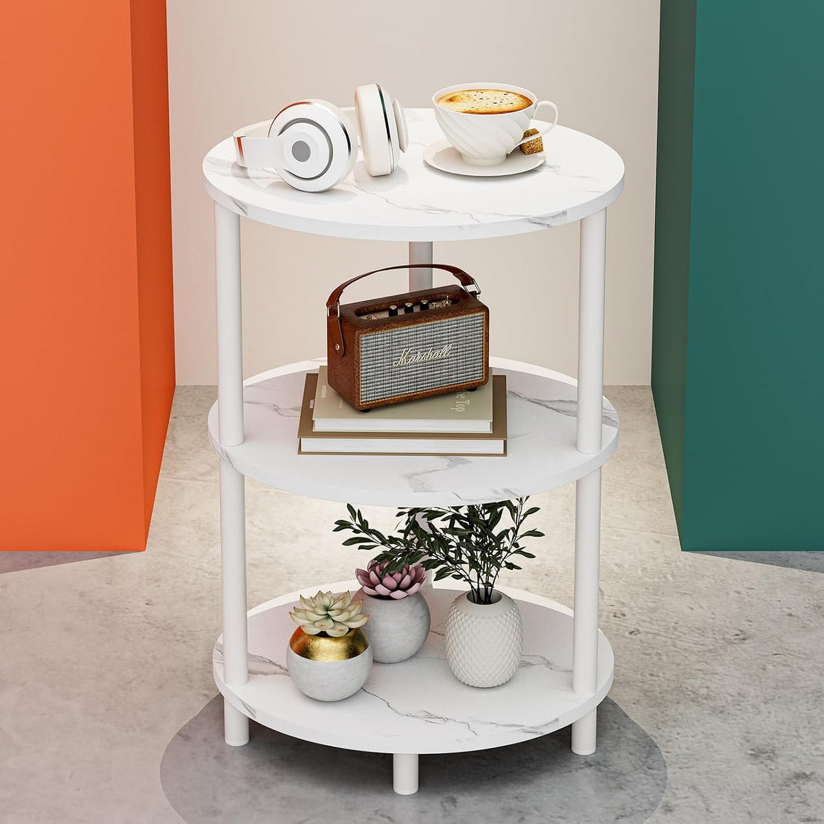 Same three-tier round end table styled with a small radio and books on the middle shelf and succulent pots on the bottom
