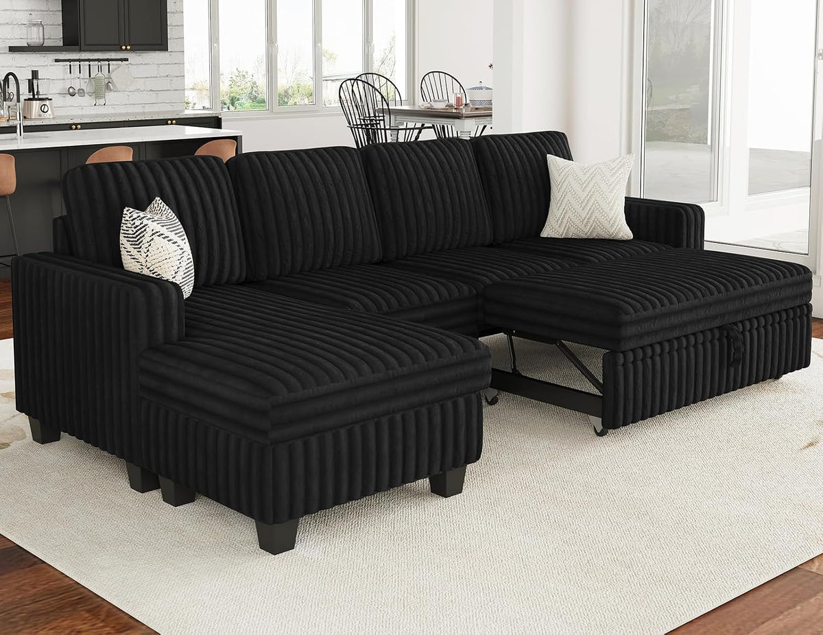 Black corduroy sectional with the left ottoman moved forward, exposing caster wheels and connector hardware.