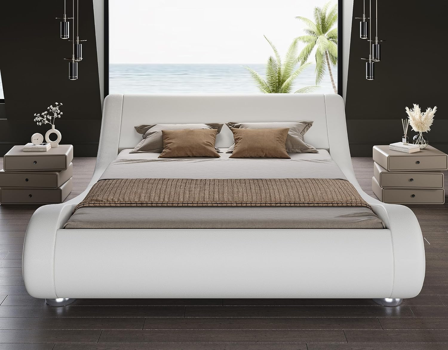 Front view of white faux leather wave bed with curved headboard and twin nightstands in a staged room