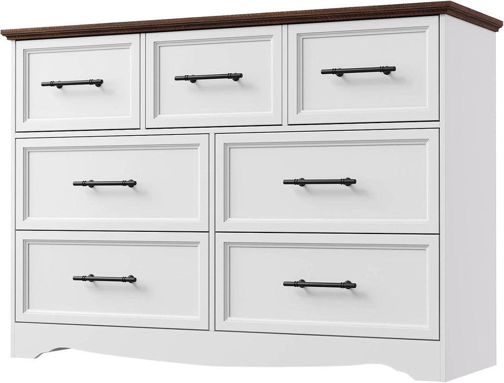 Wide white dresser with dark wood top featuring eight drawers and black handles.
