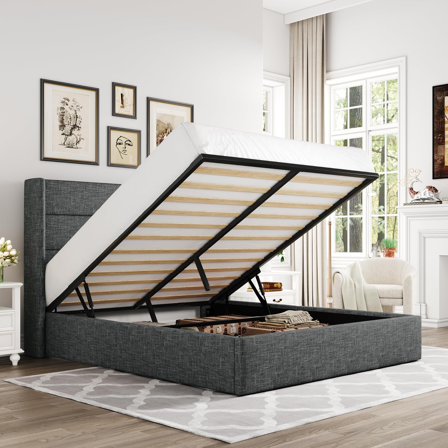 Dark gray upholstered storage bed shown with mattress lifted to reveal inside storage