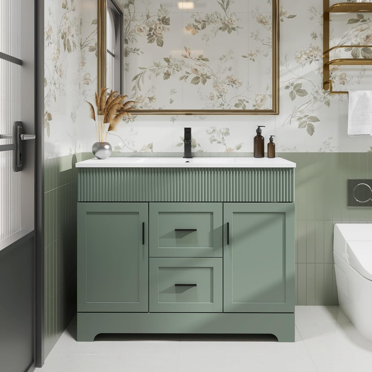 Front view of a single-sink sage green bathroom vanity with fluted top panel and drawer doors.