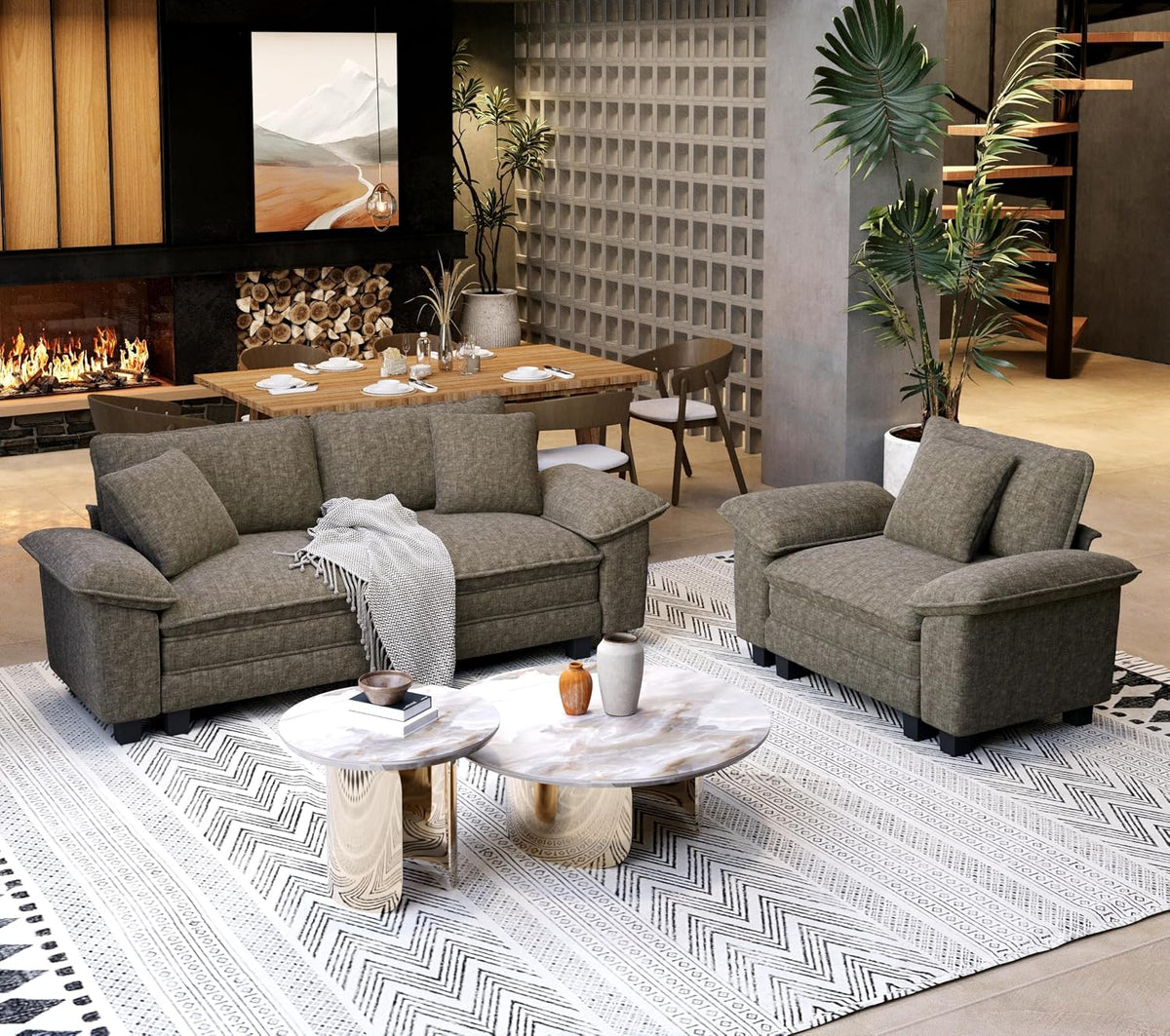 Olive-green loveseat and matching chair styled with throw and low round nesting tables on a patterned rug.
