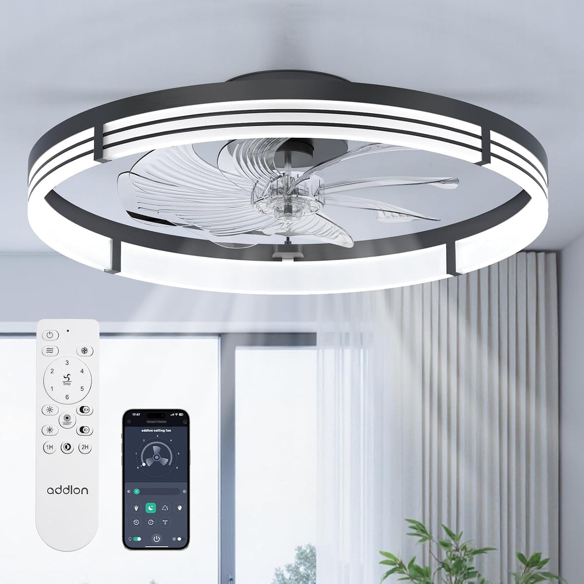 Underside view of ceiling fan with illuminated concentric ring and transparent blades visible against a windowed room.