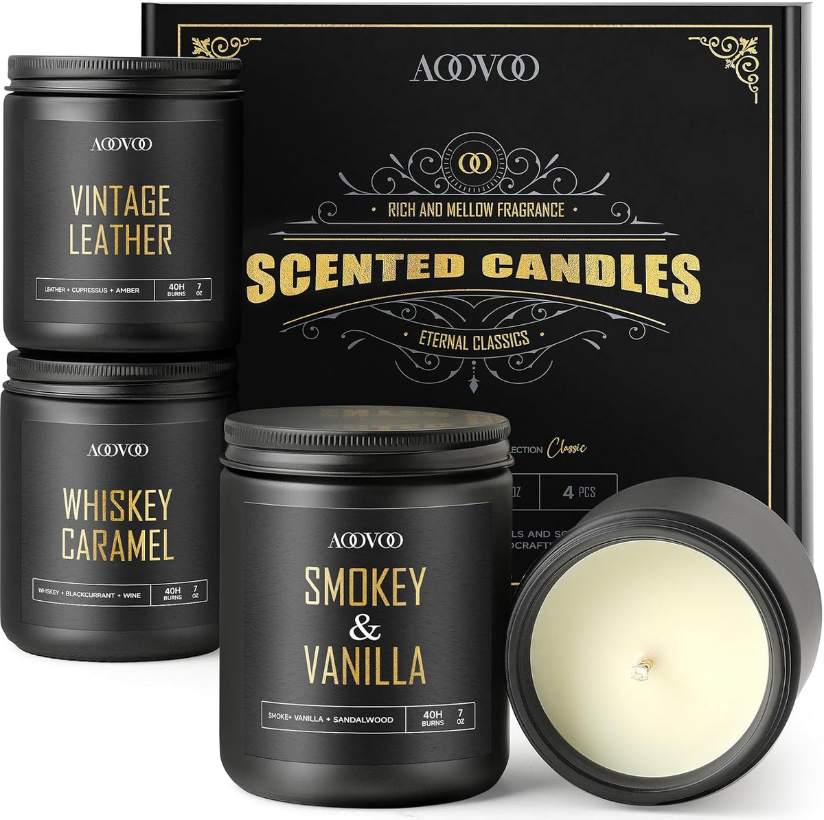 Three matte black candle jars stacked beside a matching box, one jar tipped to show the unlit cream wax inside.