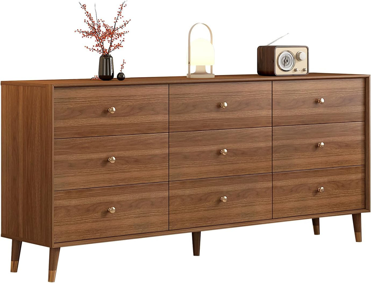 Brown mid-century dresser with nine drawers, angled front view showing tapered legs and brass-style knobs