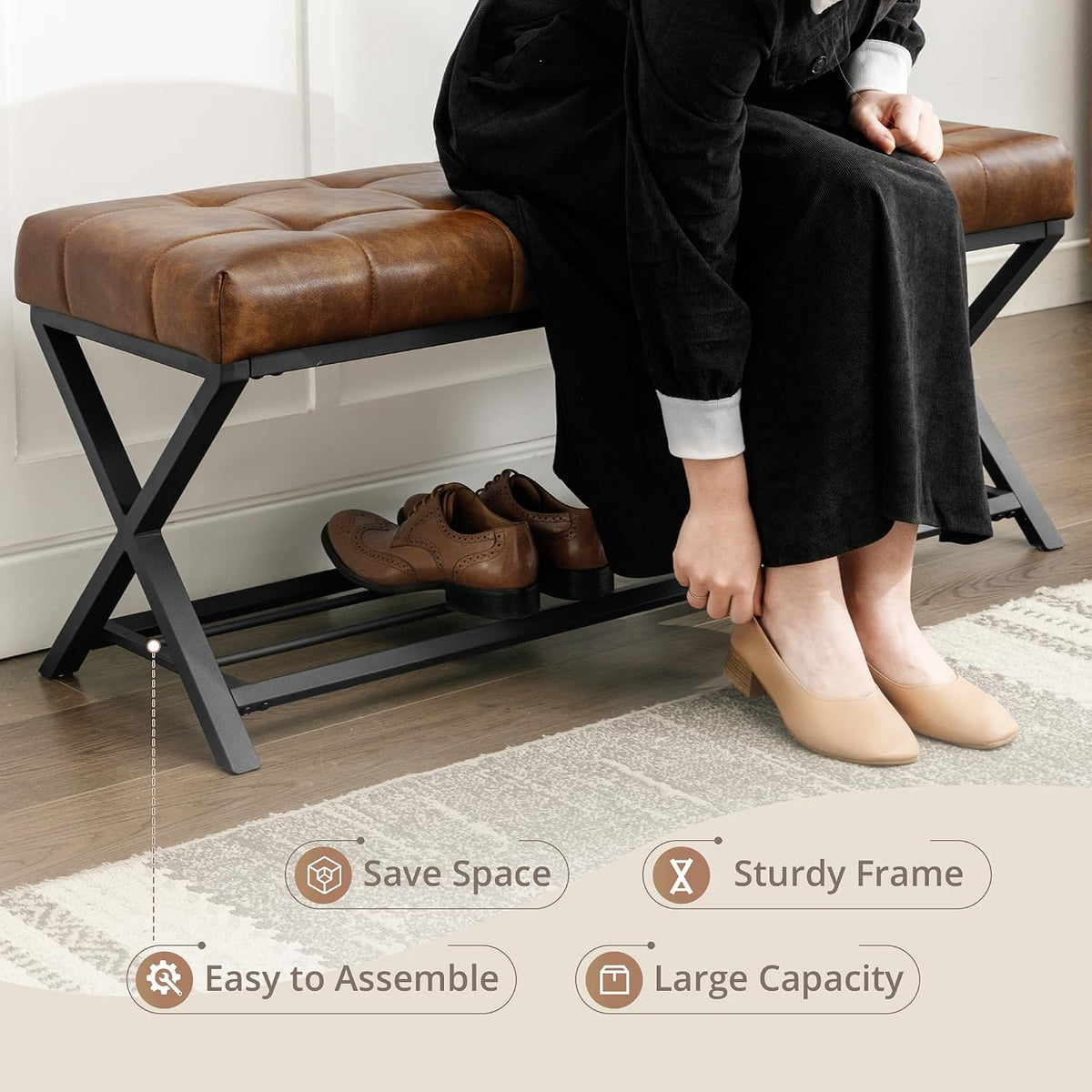 Person seated on tufted bench tying shoes with the lower shelf used for footwear, side view