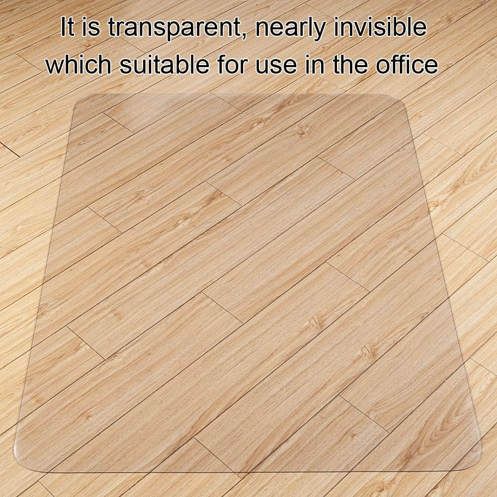 Top-down view of a clear rectangular mat laid on a light wood floor showing the nearly invisible transparency