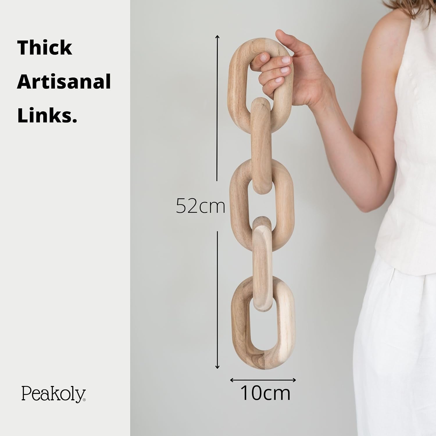 Vertical acacia wood chain held by a person with on-image measurement graphics showing 52 cm length and 10 cm link width.