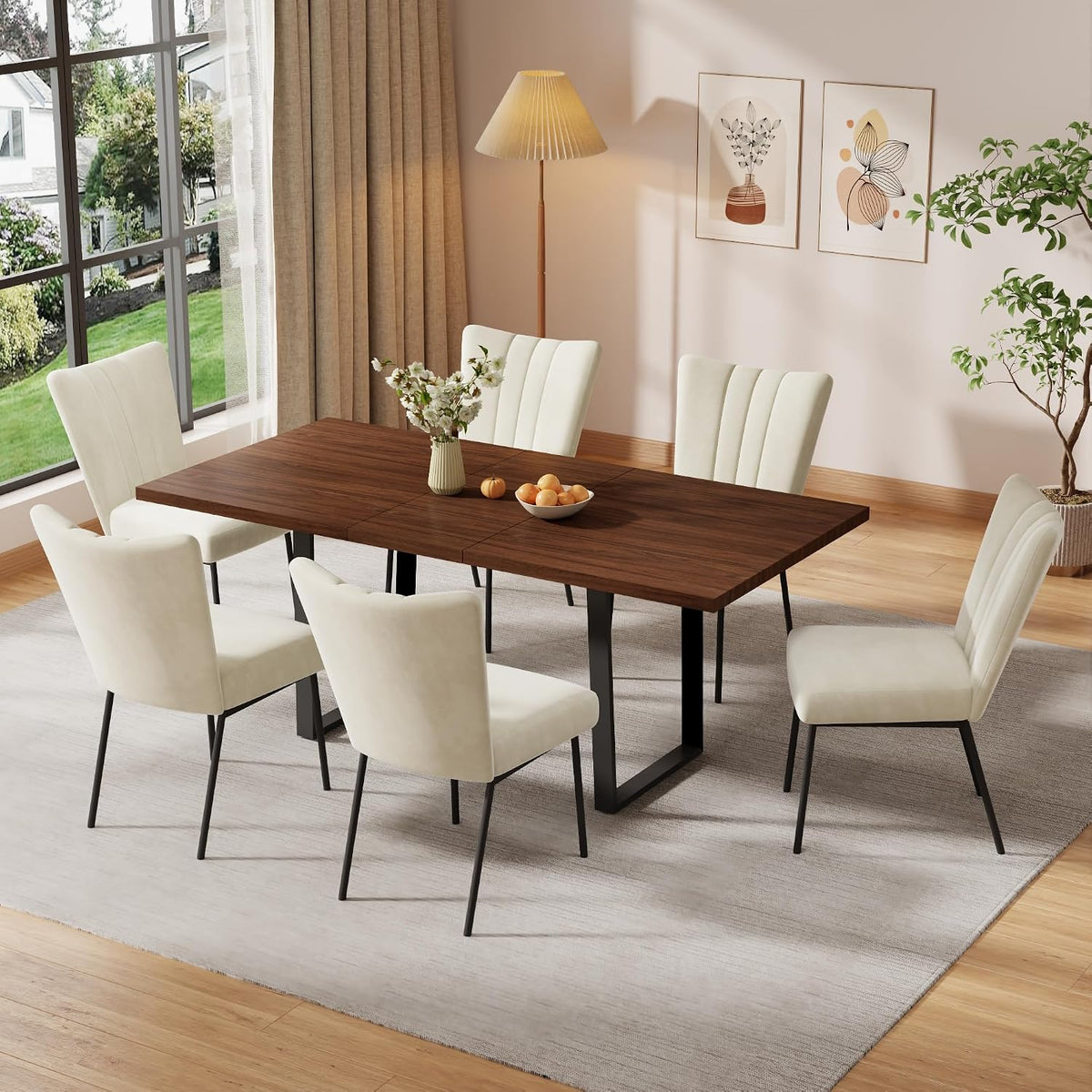 Rectangular dark wood table with cream upholstered high-back chairs in a sunlit dining room.