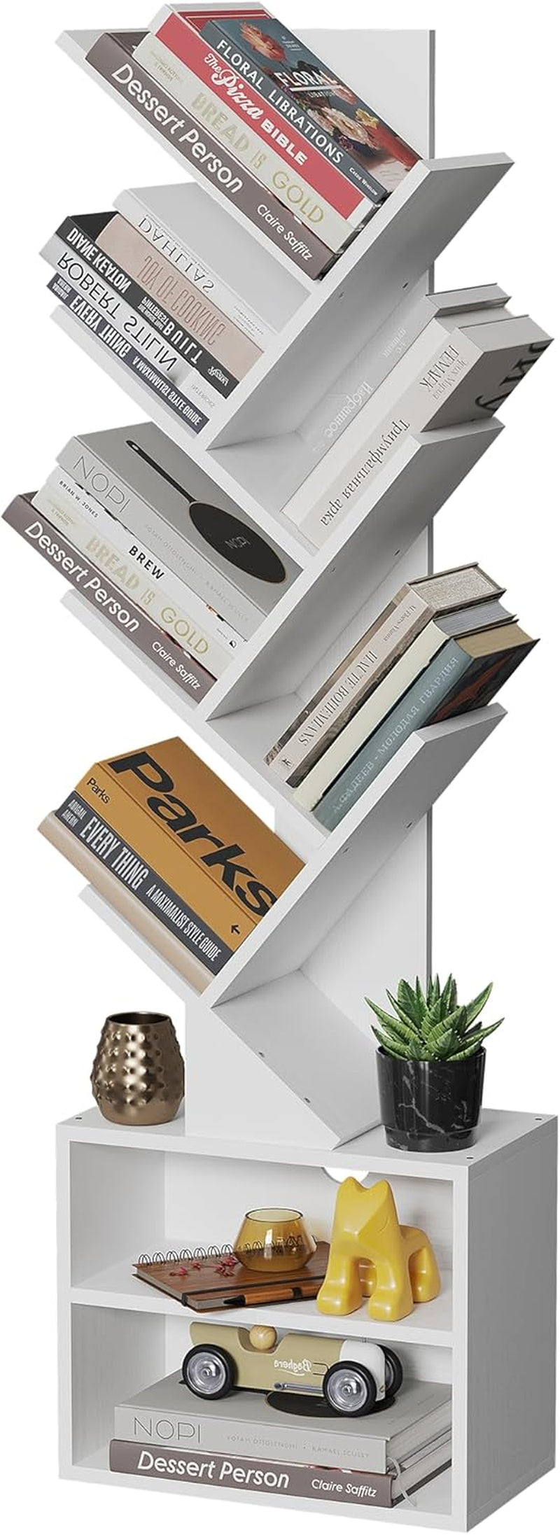 Tall white zigzag bookshelf with lower cube cabinet, books and small decor on shelves