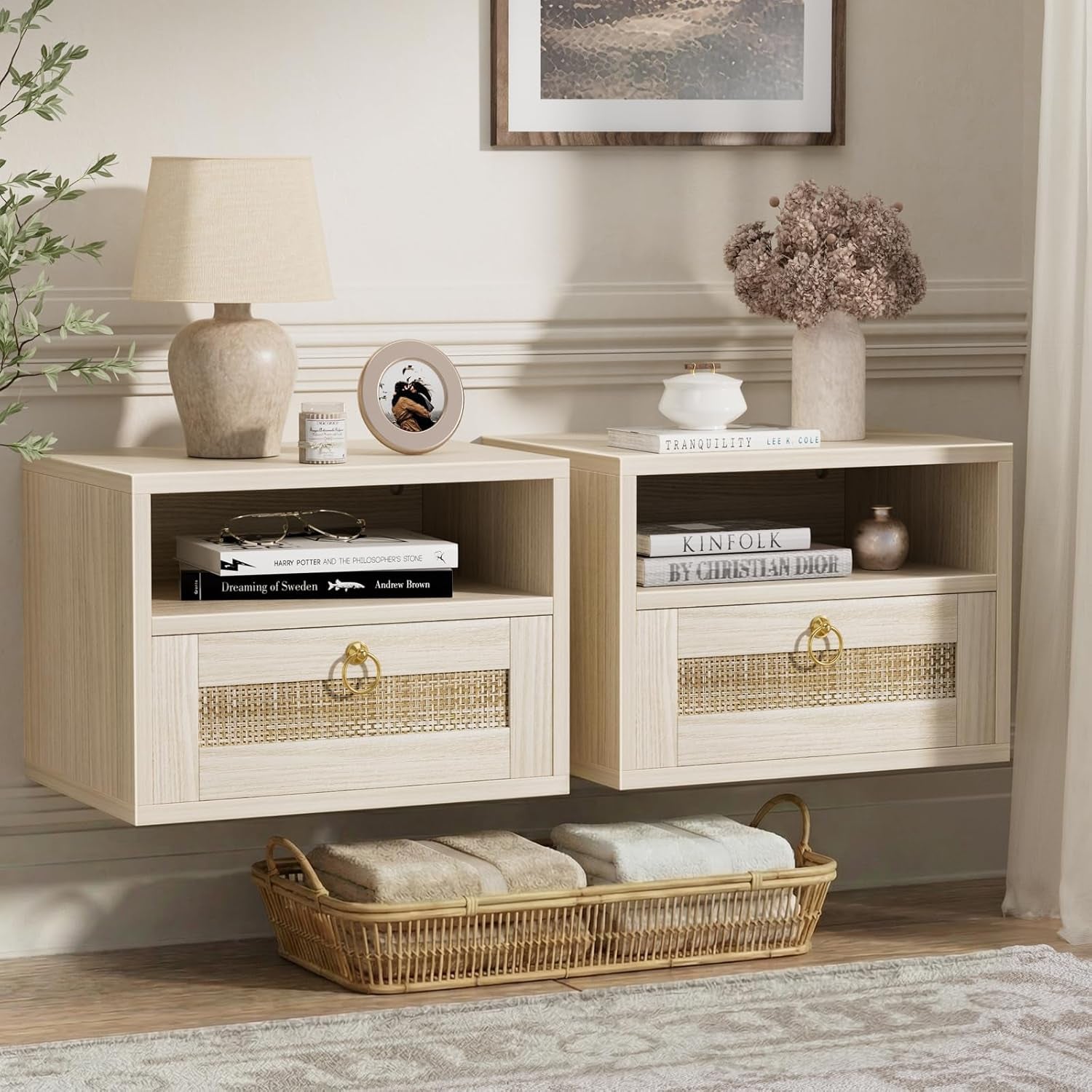 A pair of light oak floating nightstands with rattan drawer fronts mounted on a paneled wall, decorative objects and a