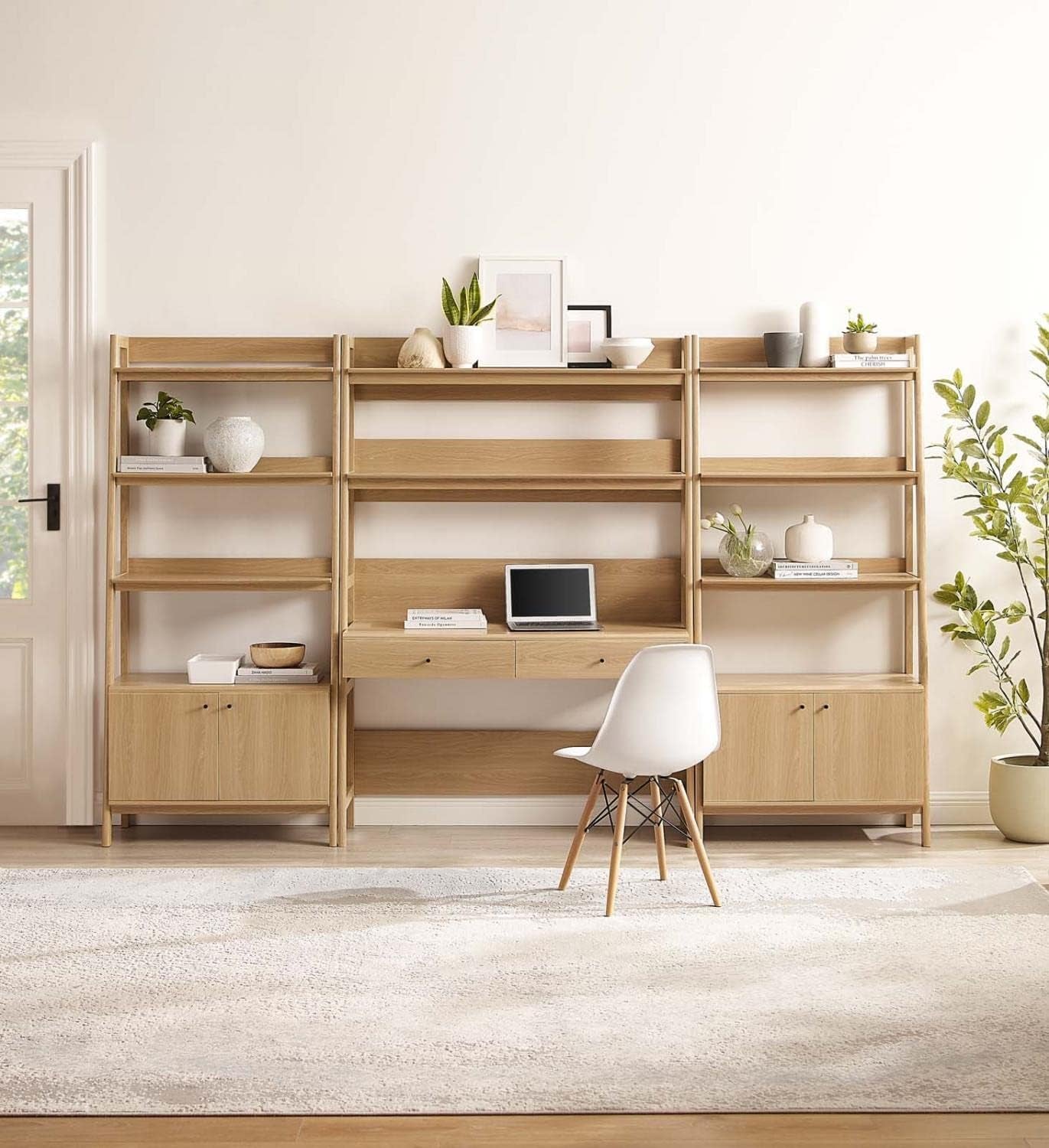 Oak finish set in a bright room, centered desk with laptop and decorative items on the upper and middle shelves