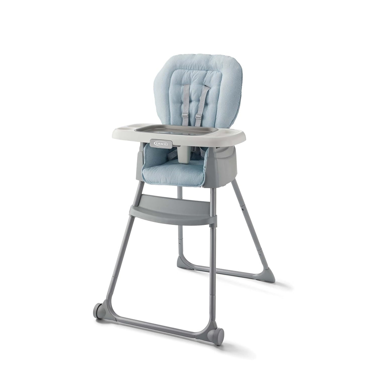 Three-quarter view of a gray highchair with blue patterned seat pad and white tray on a white background