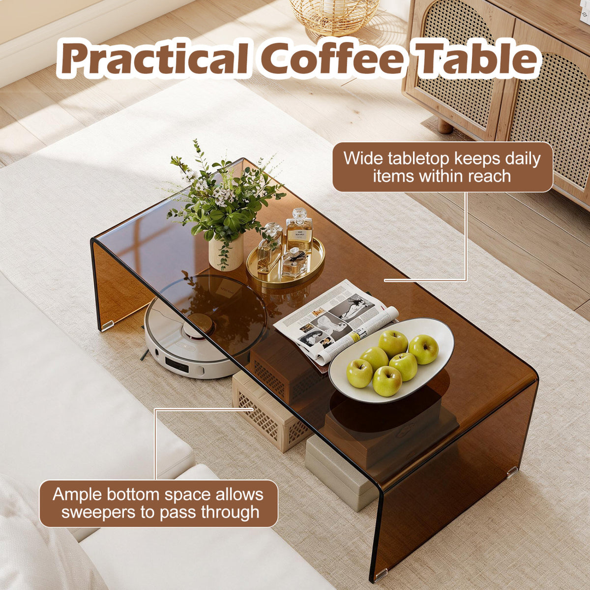 Overhead view of the glass table with decor and fruit, with a robot vacuum partly beneath it.