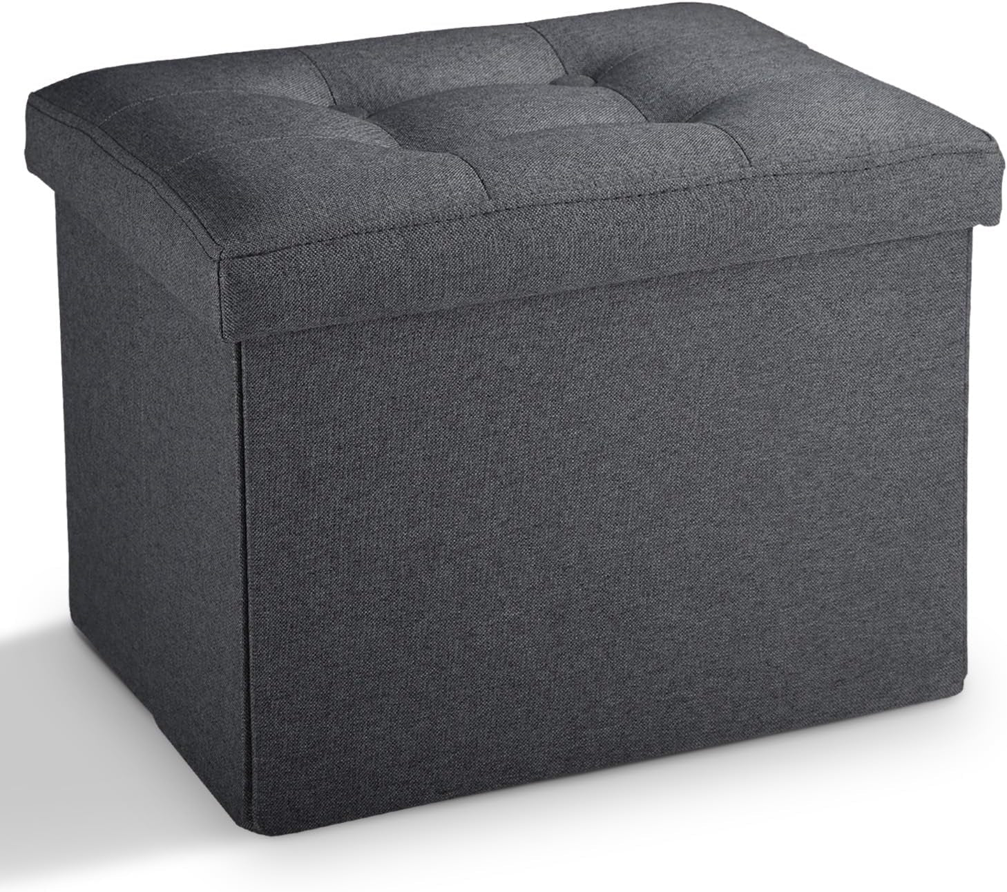Dark gray rectangular fabric storage ottoman with tufted cushioned top, shown at an angle.