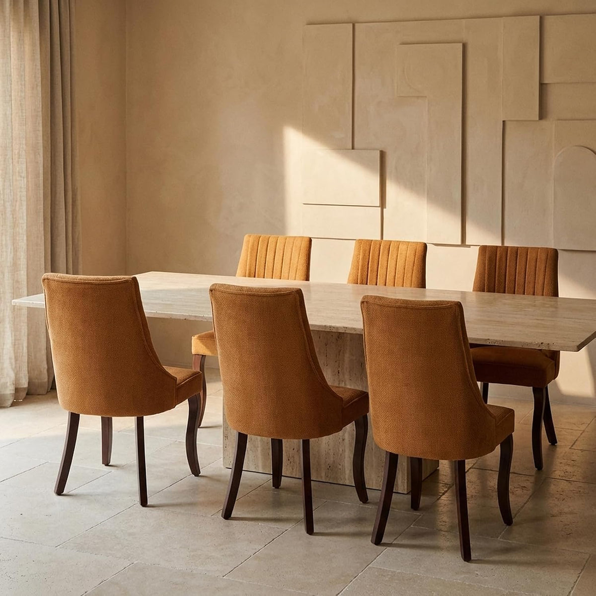 Main room shot of six tan upholstered high-back dining chairs around a rectangular stone table.