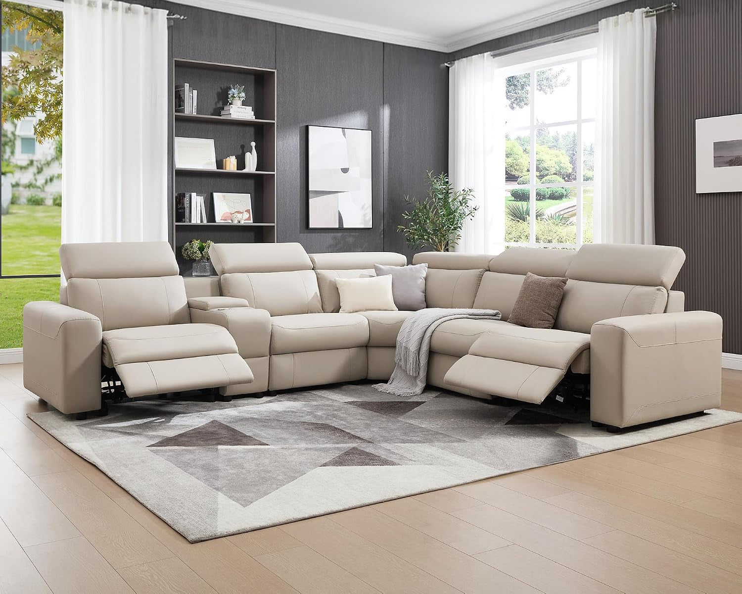 Full angled living room view of light beige power reclining sectional with footrests partially extended