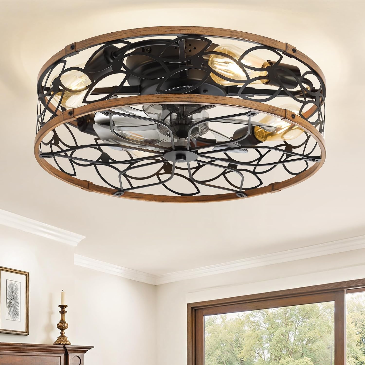 Close angled view of the metal and wood-trim cage showing exposed bulbs and fan blades inside.