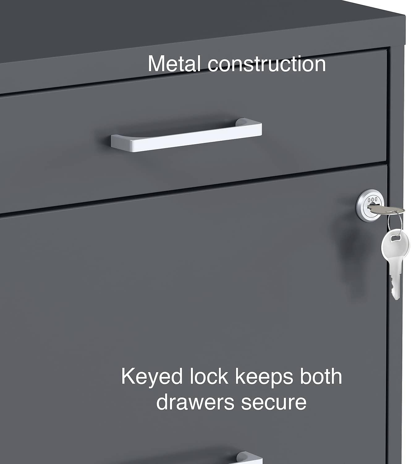 Close-up of the cabinet's lock with keys in it and a silver drawer handle on a charcoal metal front.