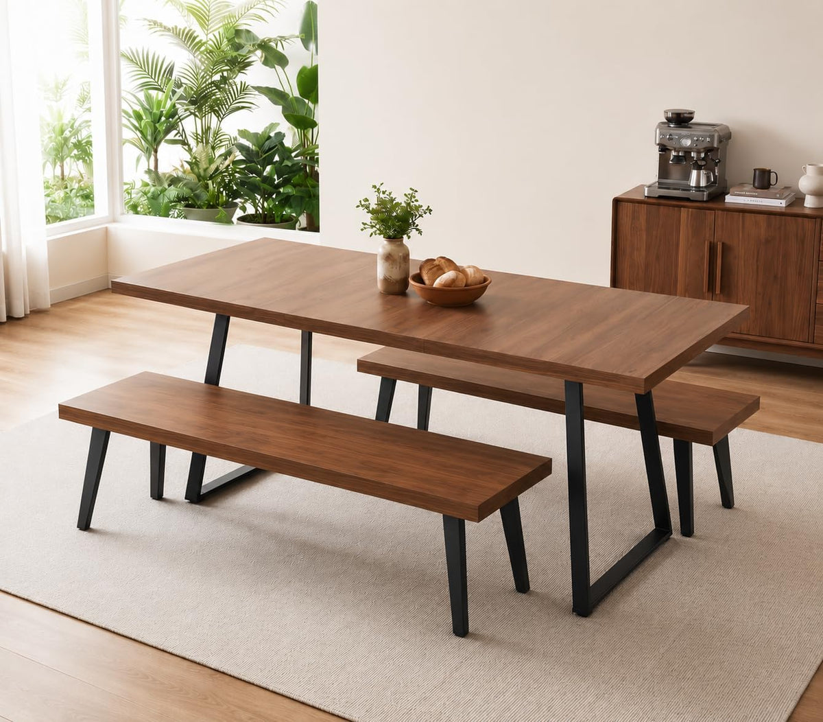 Wood-tone rectangular table paired with two matching long benches and black angled legs in a bright dining corner.