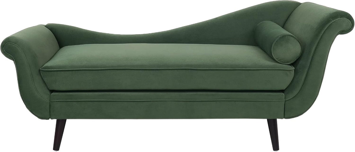 Green velvet chaise lounge with curved scrolled arms, round bolster pillow and dark tapered legs on white background
