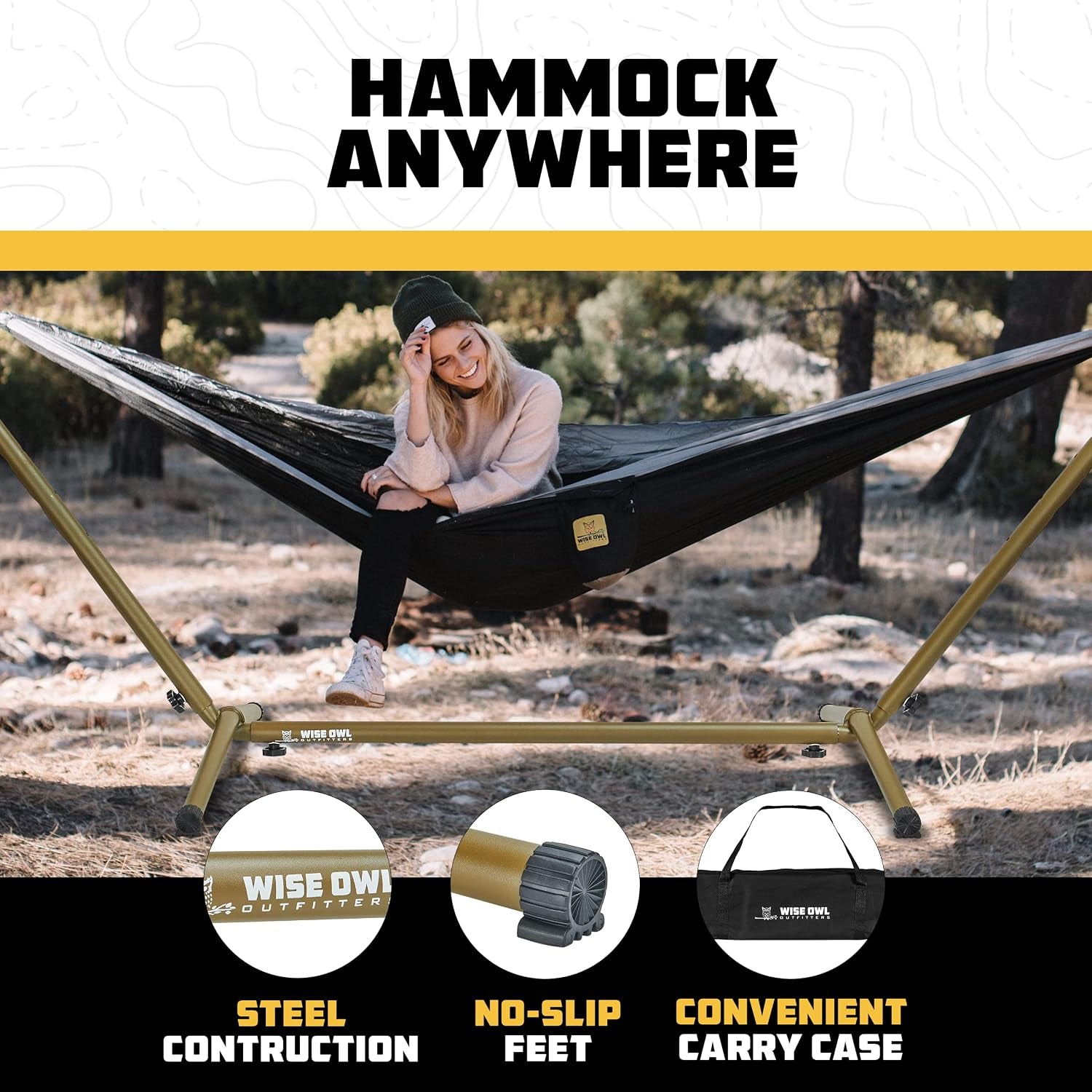 Black hammock suspended on gold steel stand with a woman seated outdoors in a woodland setting