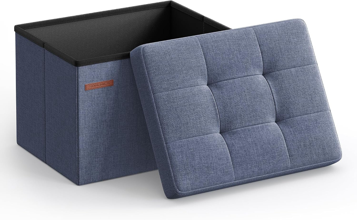 Open square folding storage ottoman with the tufted blue lid propped beside the interior box.