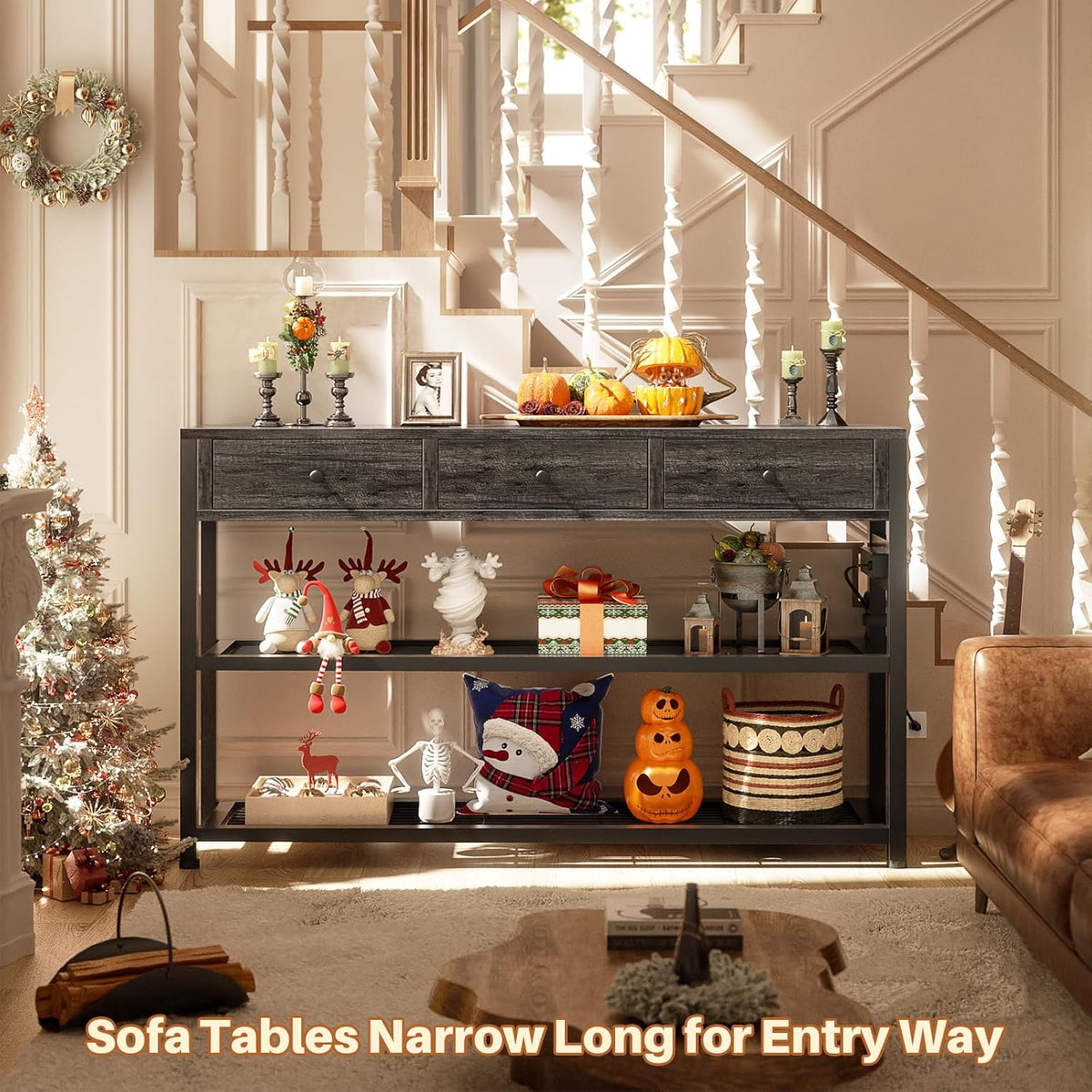 console table staged in an entryway beneath a staircase, decorated with seasonal pumpkins and ornaments