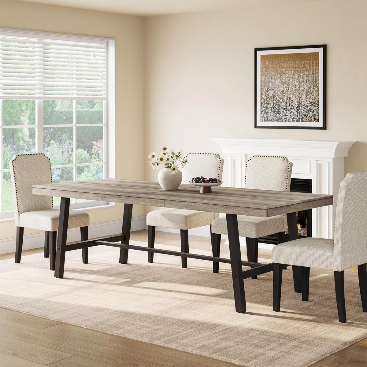 Angled view of the rectangular table with light gray wood top, black legs and vase centerpiece