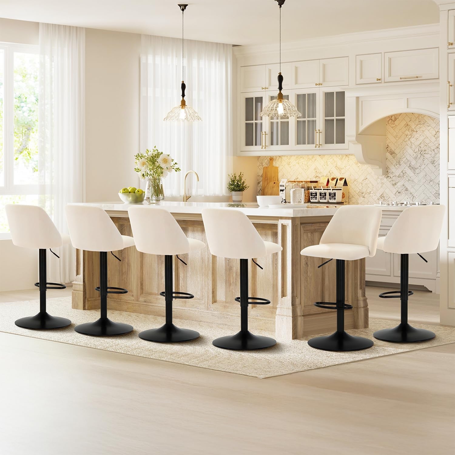 Row of six beige fabric bar stools along a kitchen island in an open bright kitchen scene
