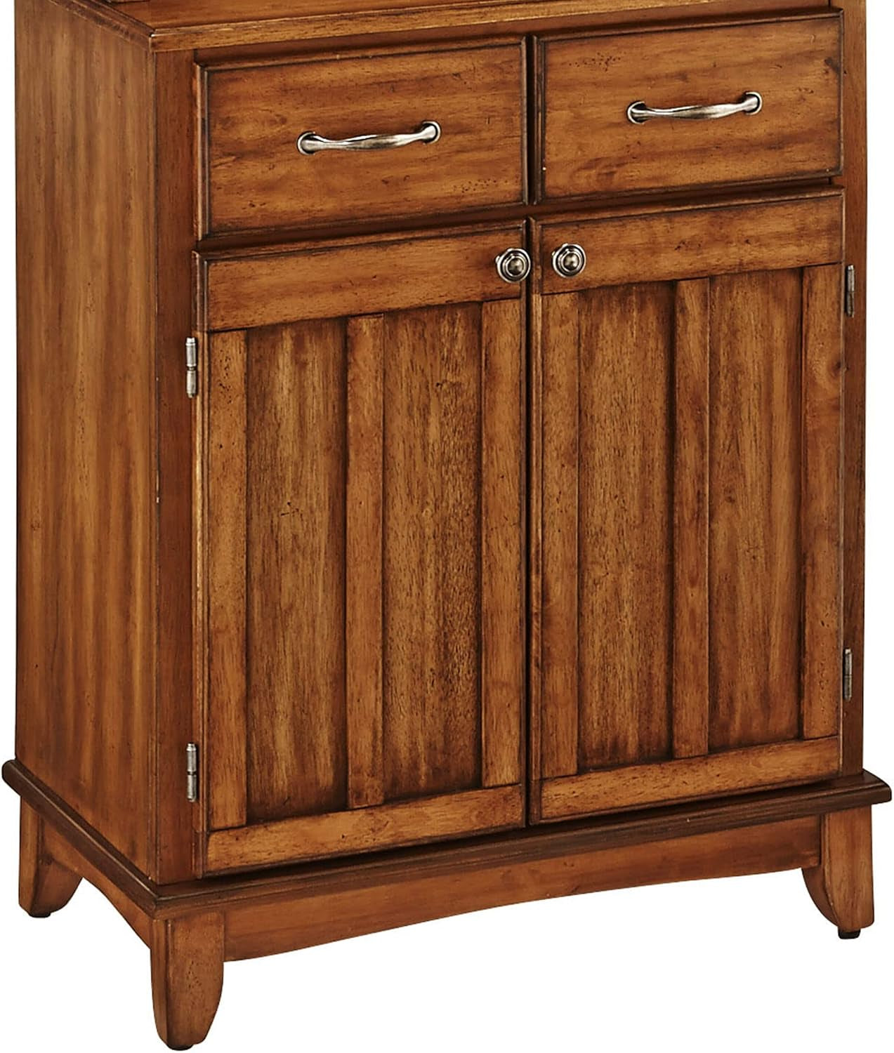 Angled view of the buffet showing wood grain, two drawers above double doors and curved skirt base