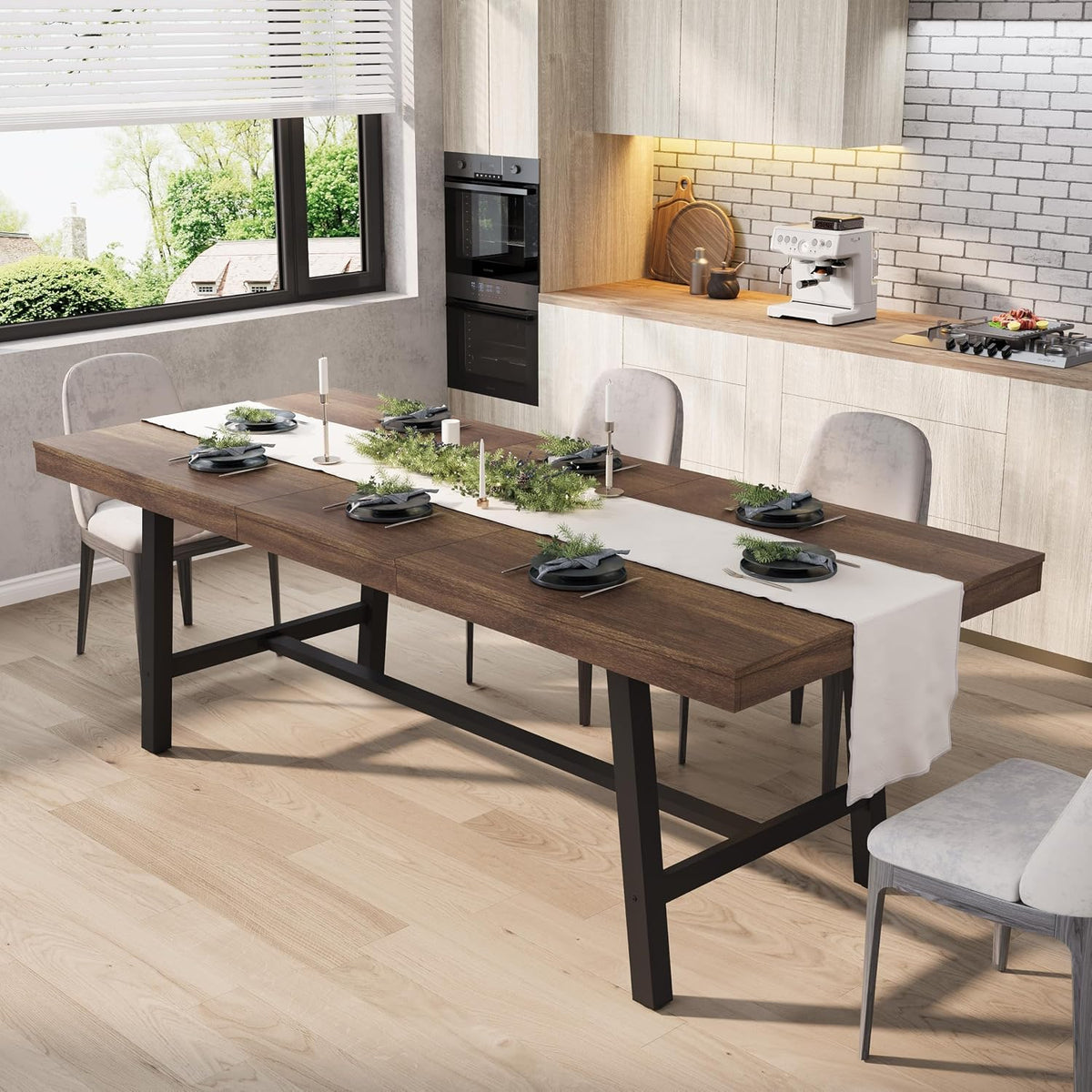 Angled view of a dark brown rectangular dining table with black metal frame and upholstered chairs in a kitchen.
