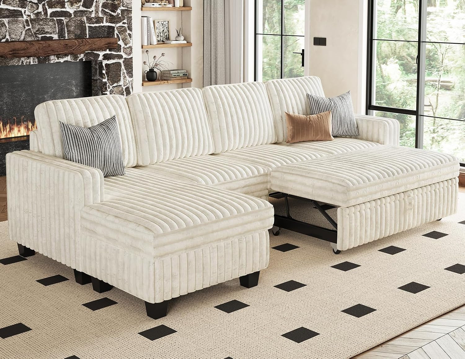 Cream corduroy sectional with chaise and partially extended pull-out bed frame visible beneath cushions.