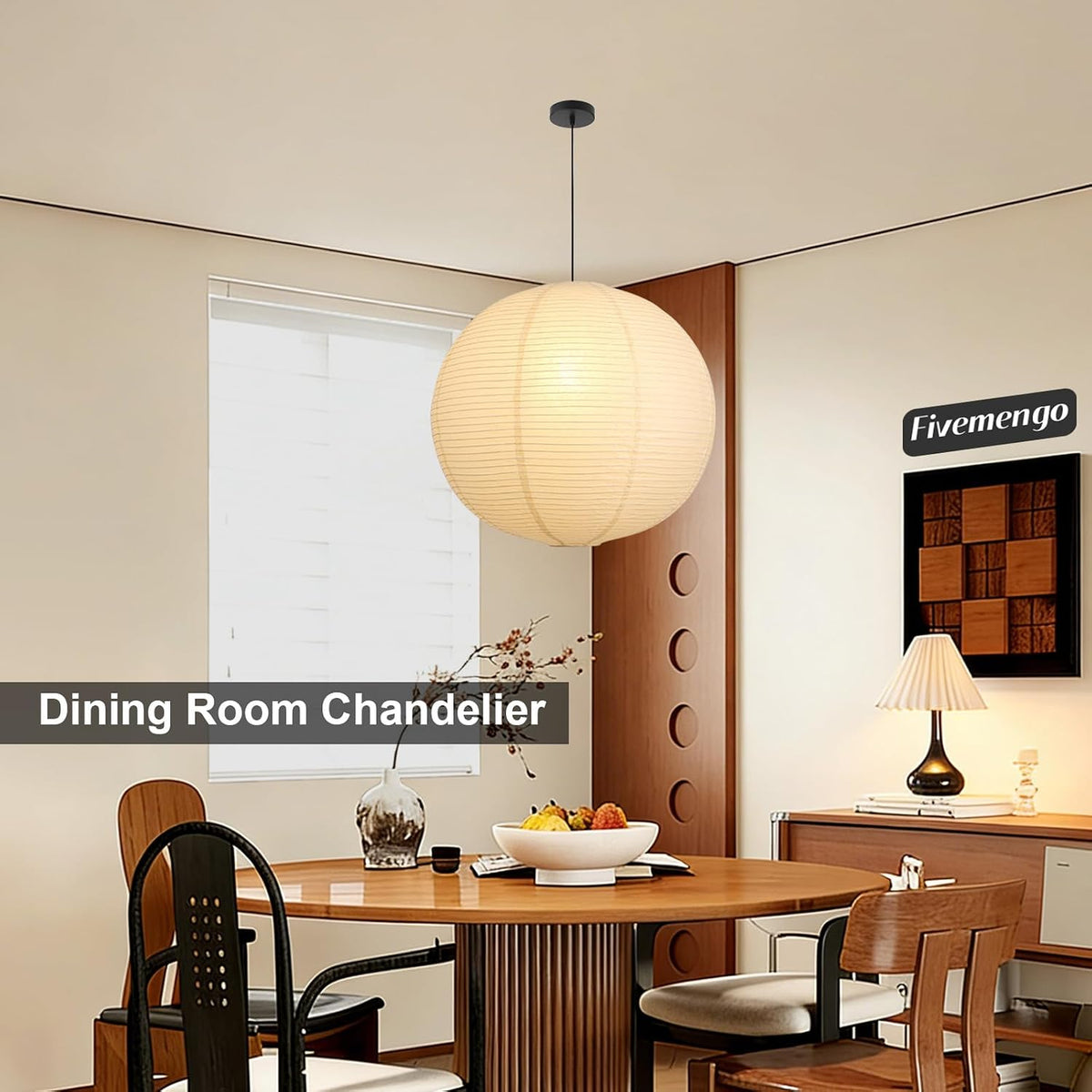 Lit off-white paper pendant hanging above a dining table in a warm modern dining room setting