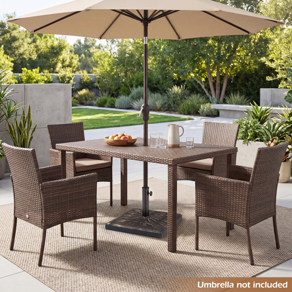 Patio umbrella base beneath a dining table and chairs in an outdoor setting