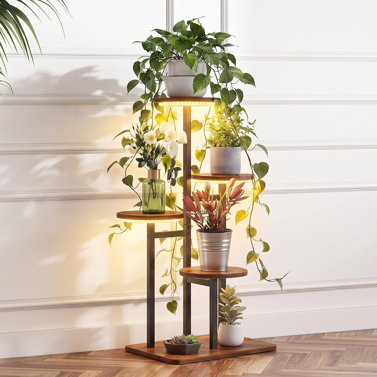Frontal cropped view of the stand's lower three tiers with potted succulents on a parquet floor and soft LED glow.