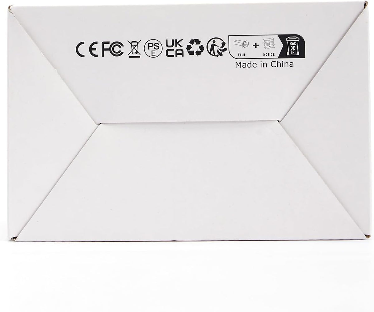 Plain white cardboard box bottom photographed flat, showing printed certification marks.