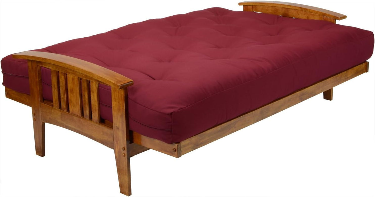 Flat bed view of full-size futon frame with tufted burgundy mattress showing foot end and wooden legs