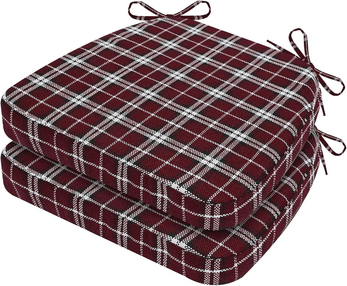 Two stacked D-shaped seat cushions in a burgundy plaid pattern with tied corner straps visible.