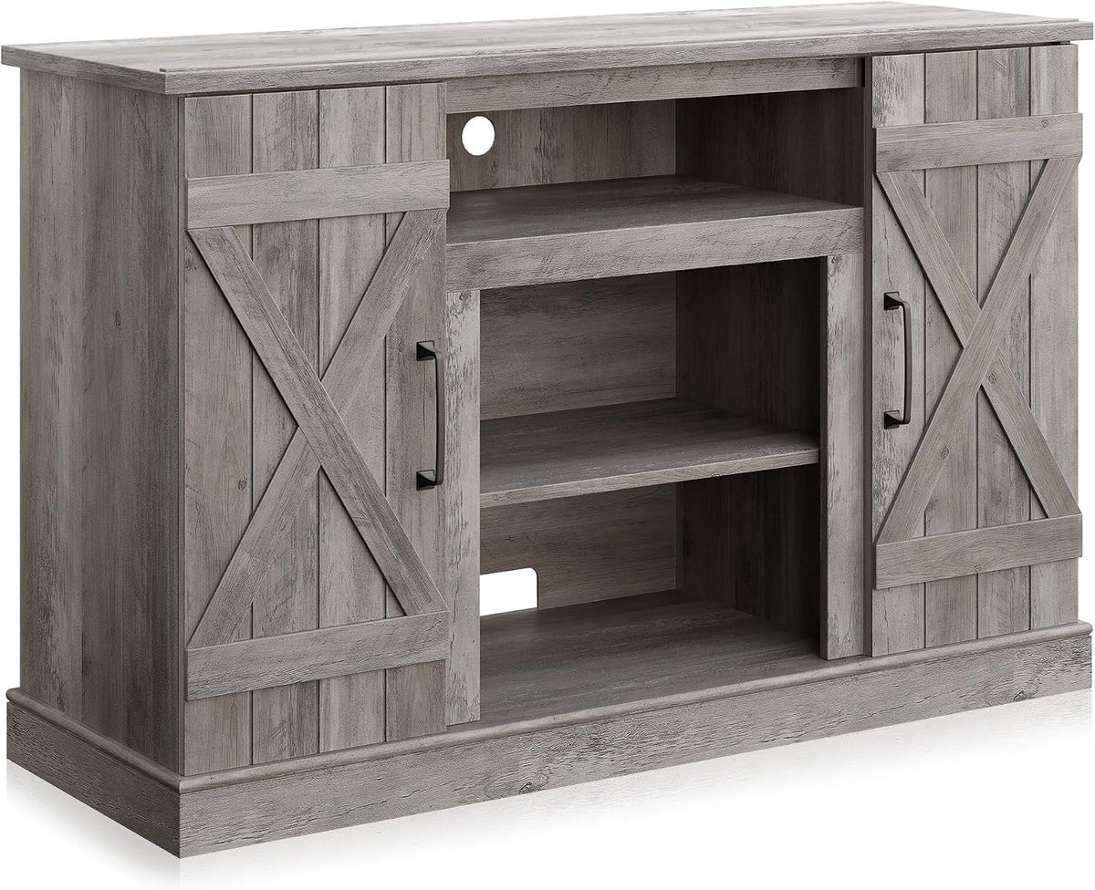 Unlit stand from a three-quarter angle showing open media shelves, cable pass-through hole and textured ashland pine finish.
