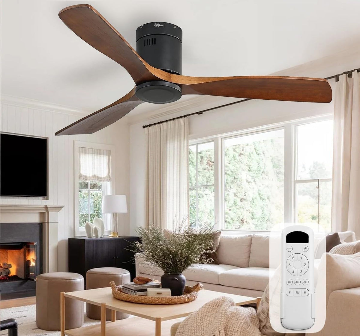 Brown wood-blade ceiling fan installed over a living room with the white remote control visible in the foreground