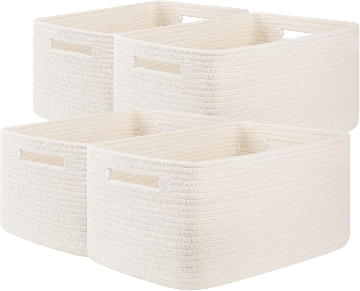 Studio photo of four white rope baskets arranged in a staggered group on a white background