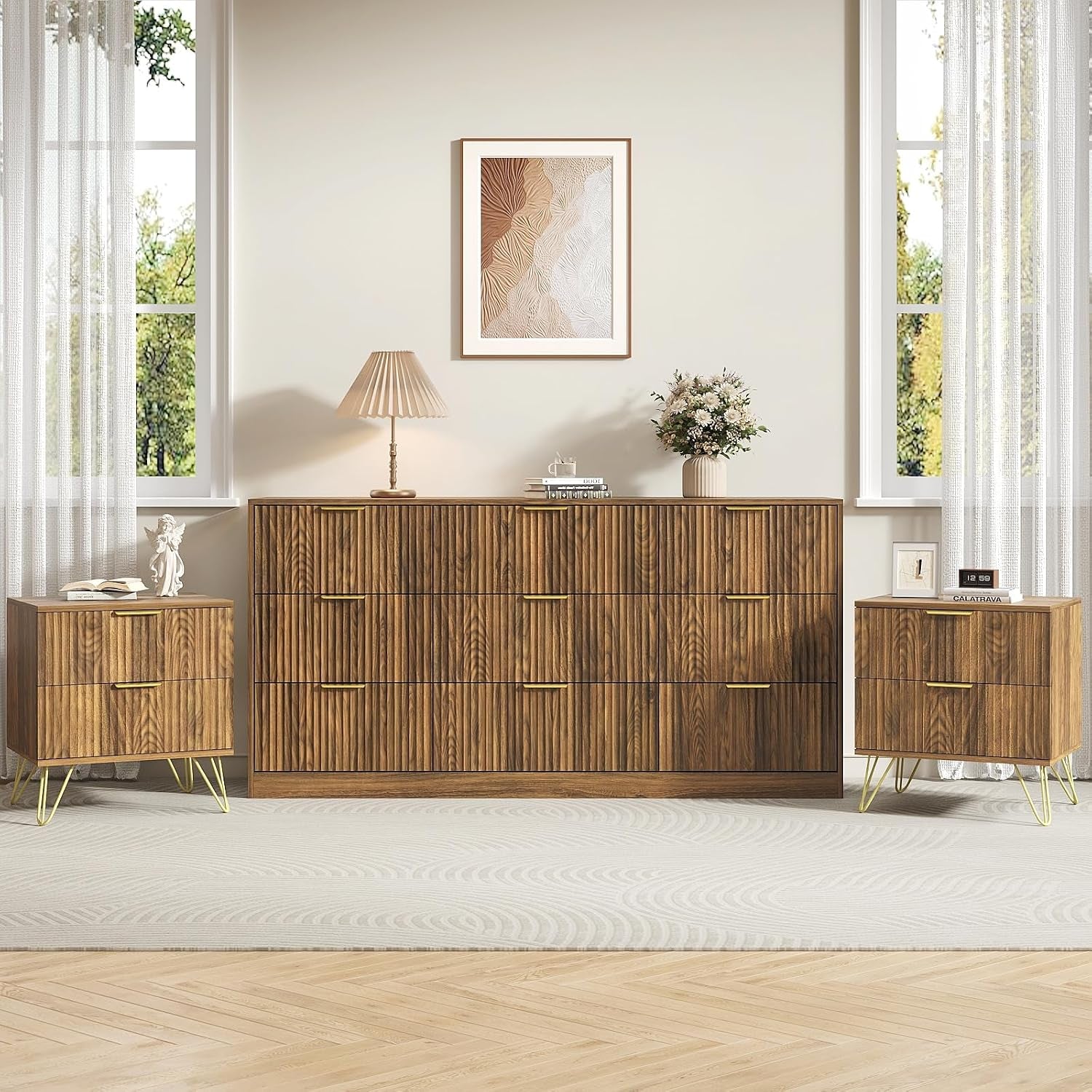 Walnut seven-drawer dresser flanked by two walnut nightstands under a framed print in a styled bedroom.