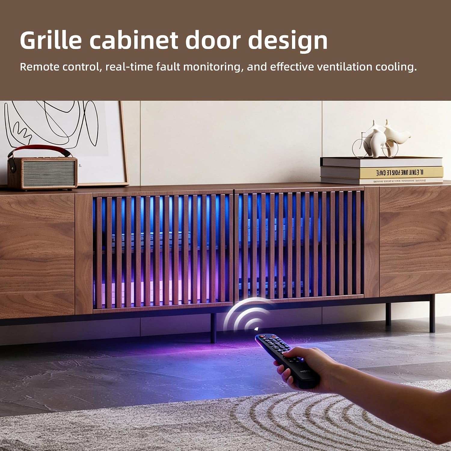 Brown TV stand with two illuminated slatted center doors and a hand holding a remote.