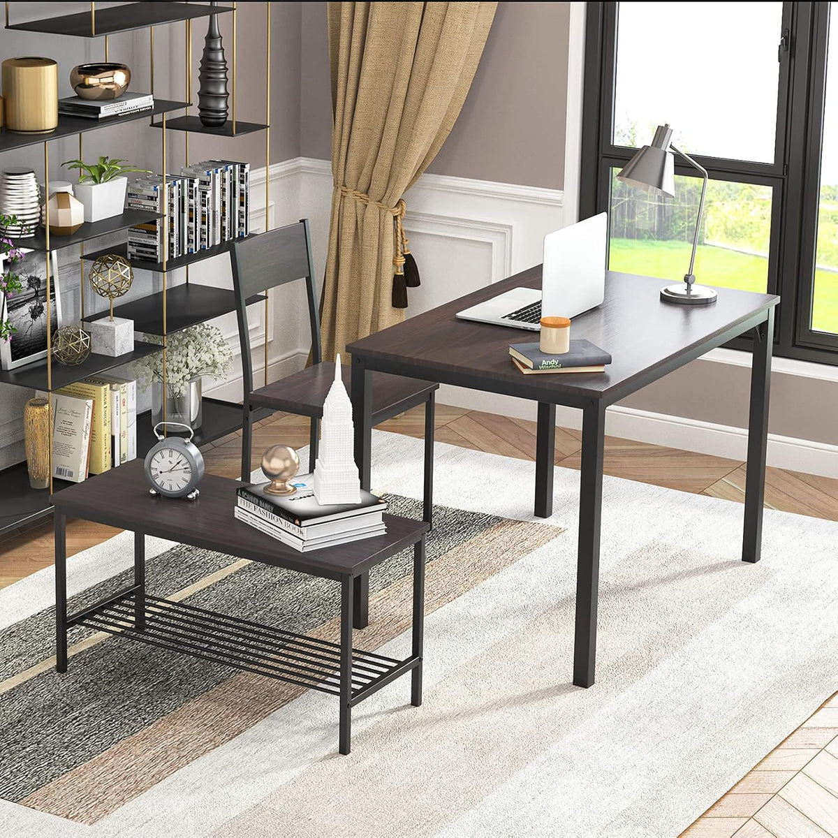 Set arranged as a home workspace with laptop on the table, chair beside it and bench in the foreground