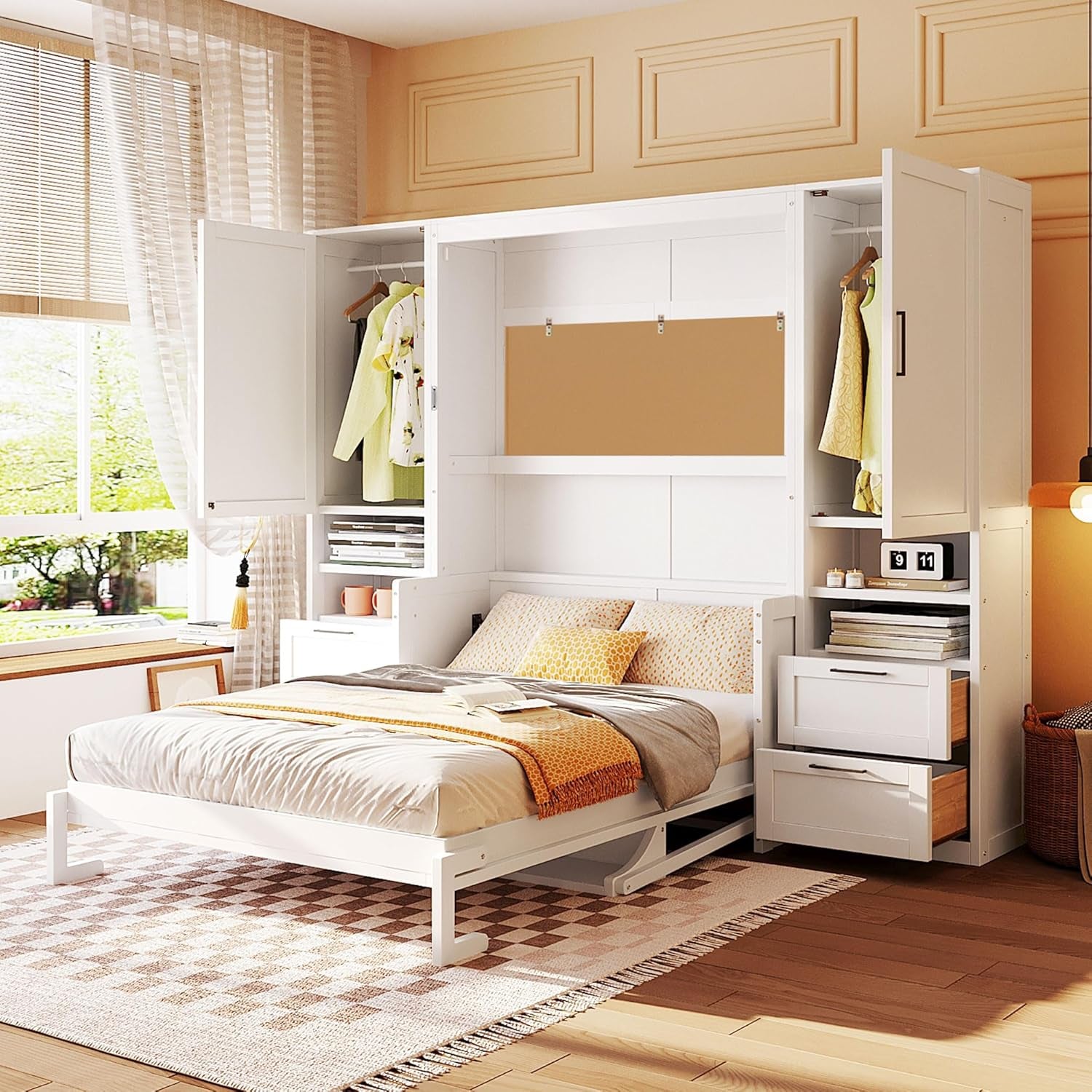 White murphy bed lowered with open wardrobe cabinets, drawers, neutral bedding and window seating